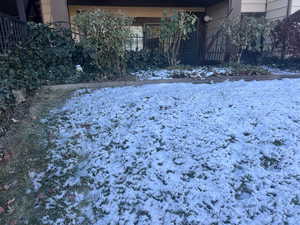 View of yard covered in snow