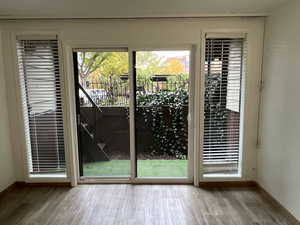 Doorway to outside with hardwood / wood-style flooring