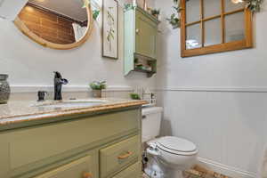 Bathroom with vanity and toilet