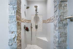 Bathroom featuring tiled shower