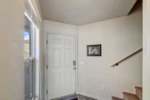 Foyer featuring a textured ceiling