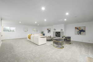 Upstairs living room featuring gas fireplace and plenty of space