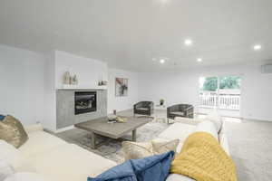 Upstairs living room with exit to backyard deck