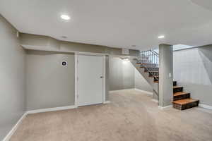 Basement with carpet flooring