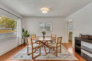 Dining space with light wood-type flooring