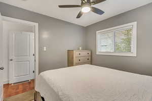 Bedroom featuring hardwood / wood-style floors and ceiling fan