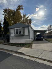 View of front of home with a carport