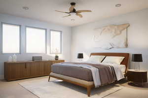 Carpeted bedroom with ceiling fan