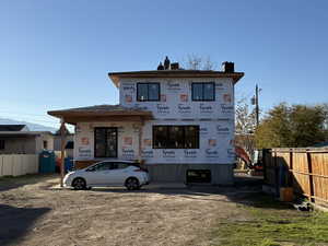 Property in mid-construction with a chimney