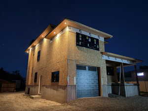 View of property exterior at twilight
