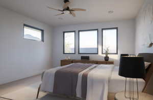 Bedroom featuring ceiling fan, carpet floors, and multiple windows