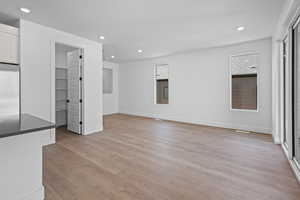 Unfurnished living room featuring light hardwood / wood-style floors