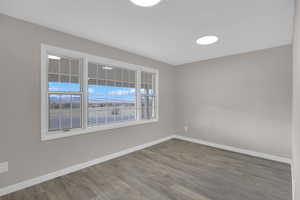 Spare room featuring hardwood / wood-style floors