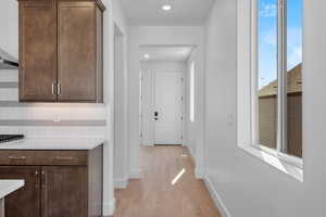 Hallway featuring light hardwood / wood-style floors