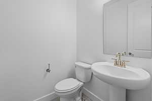 Bathroom featuring tile patterned floors and toilet