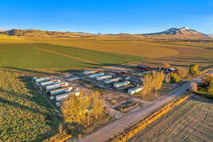 Birds eye view of property with a mountain view and a rural view