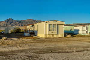 View of front of property with a mountain view