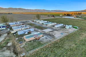 Birds eye view of property featuring a mountain view