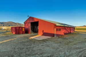 View of outbuilding with a mountain view