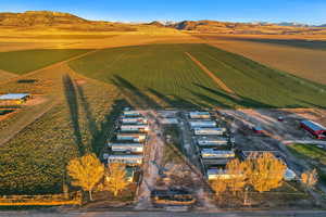 Drone / aerial view with a mountain view and a rural view