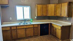 Kitchen with sink and dark hardwood / wood-style floors