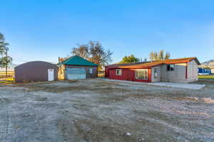 View of front of property featuring an outbuilding