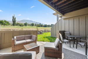 View of patio / terrace with a mountain view, a rural view, and an outdoor living space