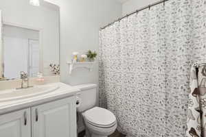 Bathroom featuring toilet and vanity