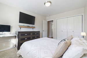 Bedroom featuring a closet and carpet floors