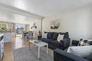 Living room with light hardwood / wood-style flooring