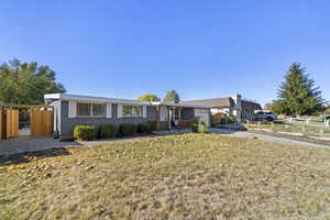 Ranch-style house with a front yard