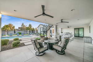 View of patio / terrace with a fenced in pool