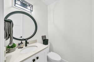 Bathroom featuring vanity and toilet