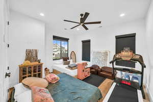 Bedroom with hardwood / wood-style flooring and ceiling fan