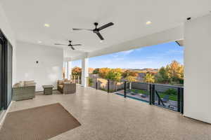 View of patio with a mountain view and a balcony