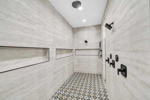 Bathroom featuring tiled shower