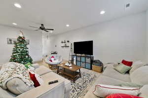 Living room featuring ceiling fan