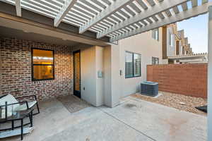 View of patio featuring a pergola and central air condition unit