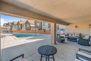 View of swimming pool with a patio area and an outdoor hangout area