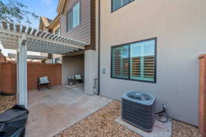 View of patio / terrace featuring a pergola and central air condition unit