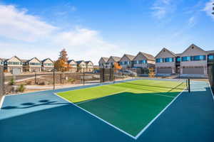 View of tennis court featuring basketball court