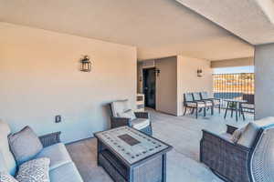 View of patio with outdoor lounge area