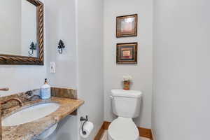 Bathroom featuring sink and toilet