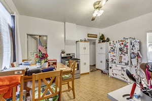 Dining space with plenty of natural light and ceiling fan