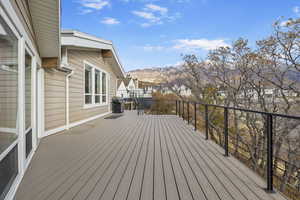 Wooden terrace featuring a mountain view