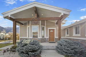 Property entrance with a mountain view and a porch