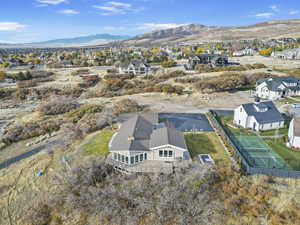 Birds eye view of property with a mountain view