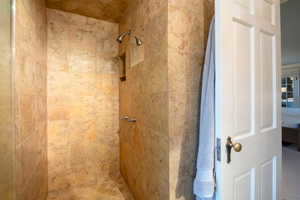 Bathroom with tiled shower