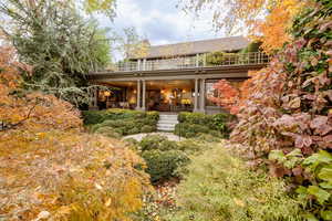 Rear view of property with a balcony