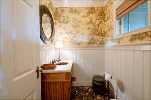 Bathroom featuring vanity and crown molding